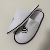 Custom White Terry Closed Toe Hotel Slippers Manufacturer | Wholesale Black Embroidered Logo Hospitality Slippers